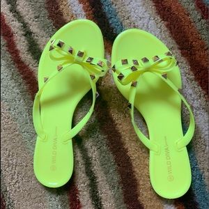 Neon yellow flip flops.